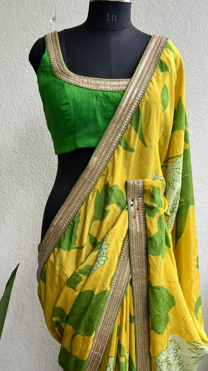 Yellow viscose saree with green silk embroidered blouse