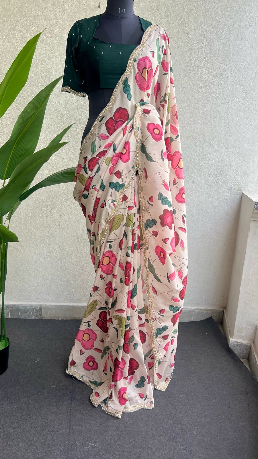 Half white floral kossa saree with green hand worked blouse