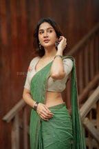 Green mul chanderi saree with halfwhite embroidery blouse