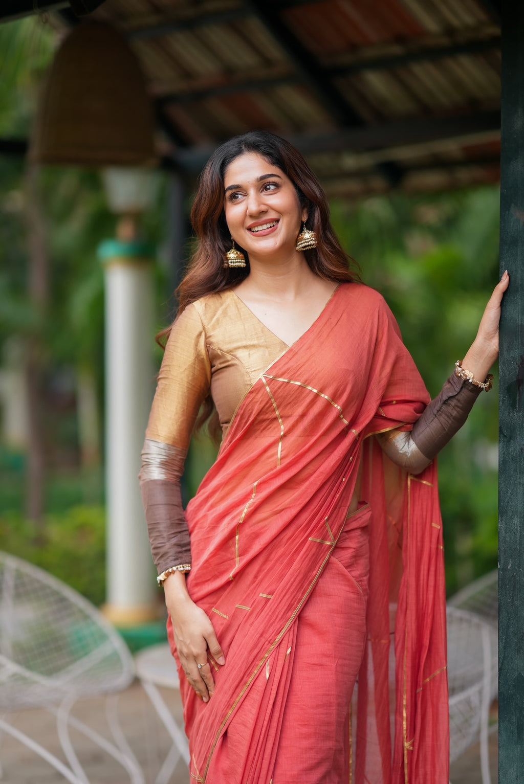 Orange rust saree with tissue handwork blouse