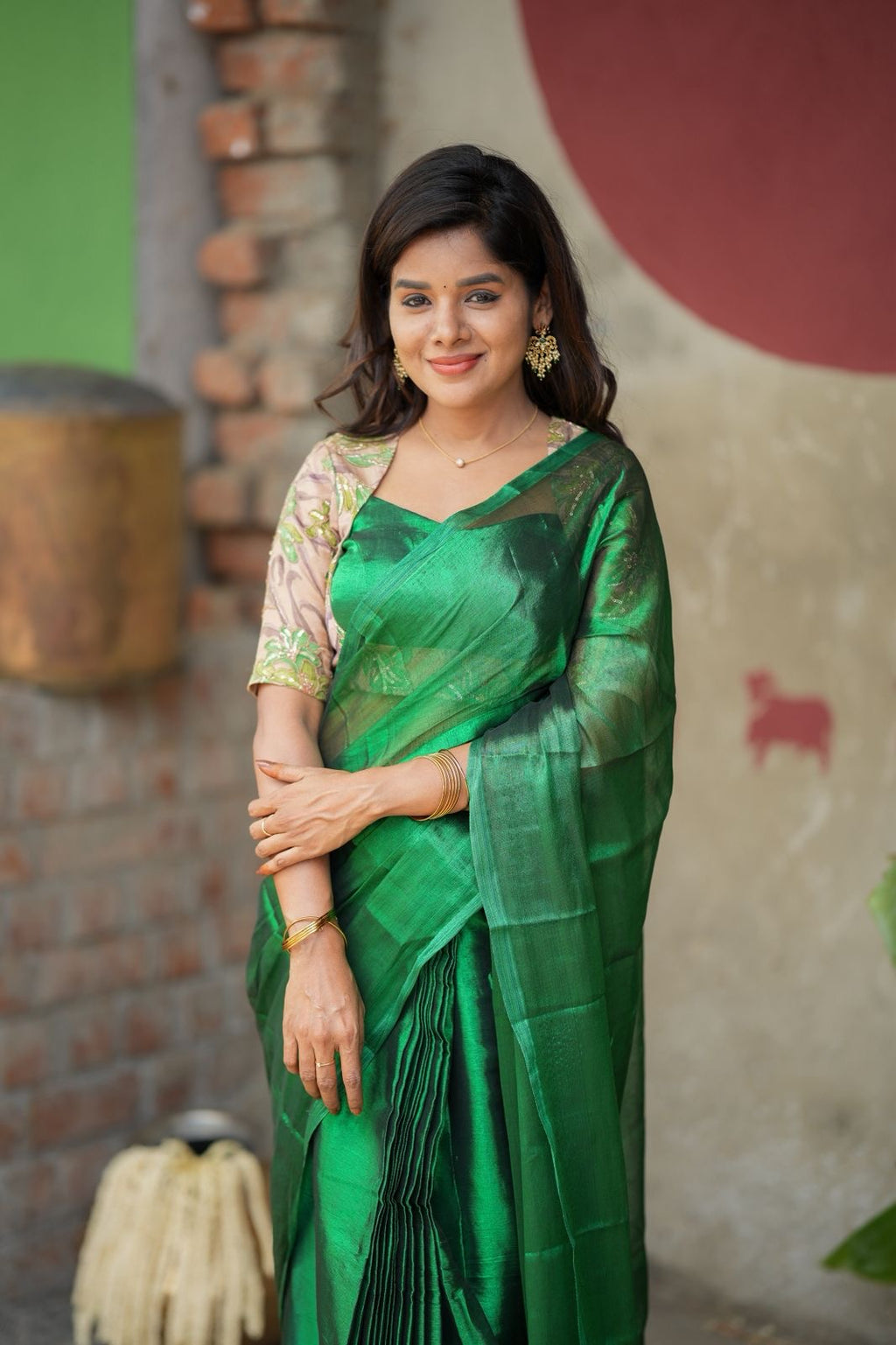 Green soft tissue saree with embroidered blouse