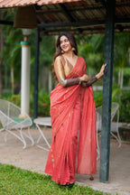Orange rust saree with tissue handwork blouse