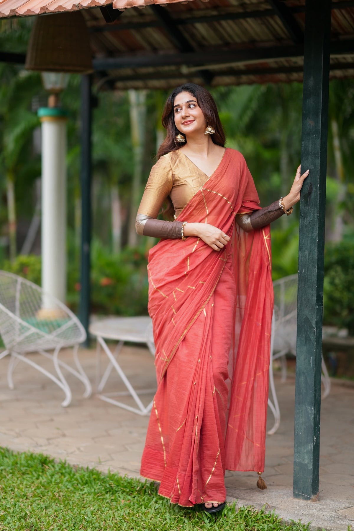 Orange rust saree with tissue handwork blouse