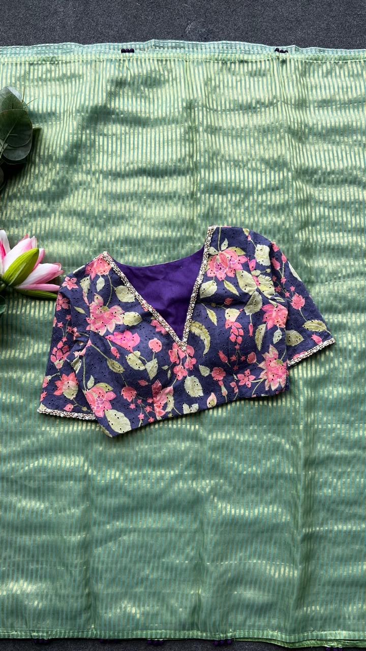 Green stripped tissue saree with purple floral hand work blouse