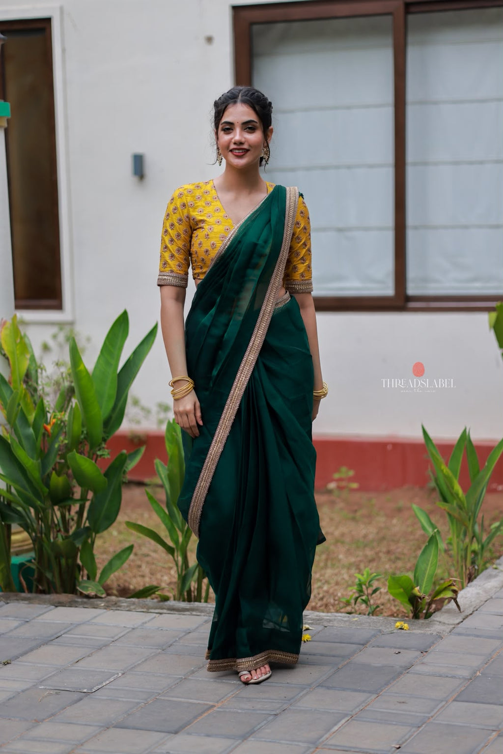 Green organza saree with yellow hand work blouse