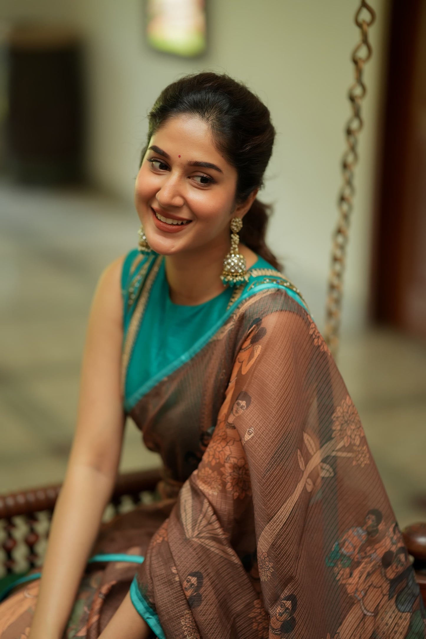 Brown kalamkari kota saree with blue hand work blouse