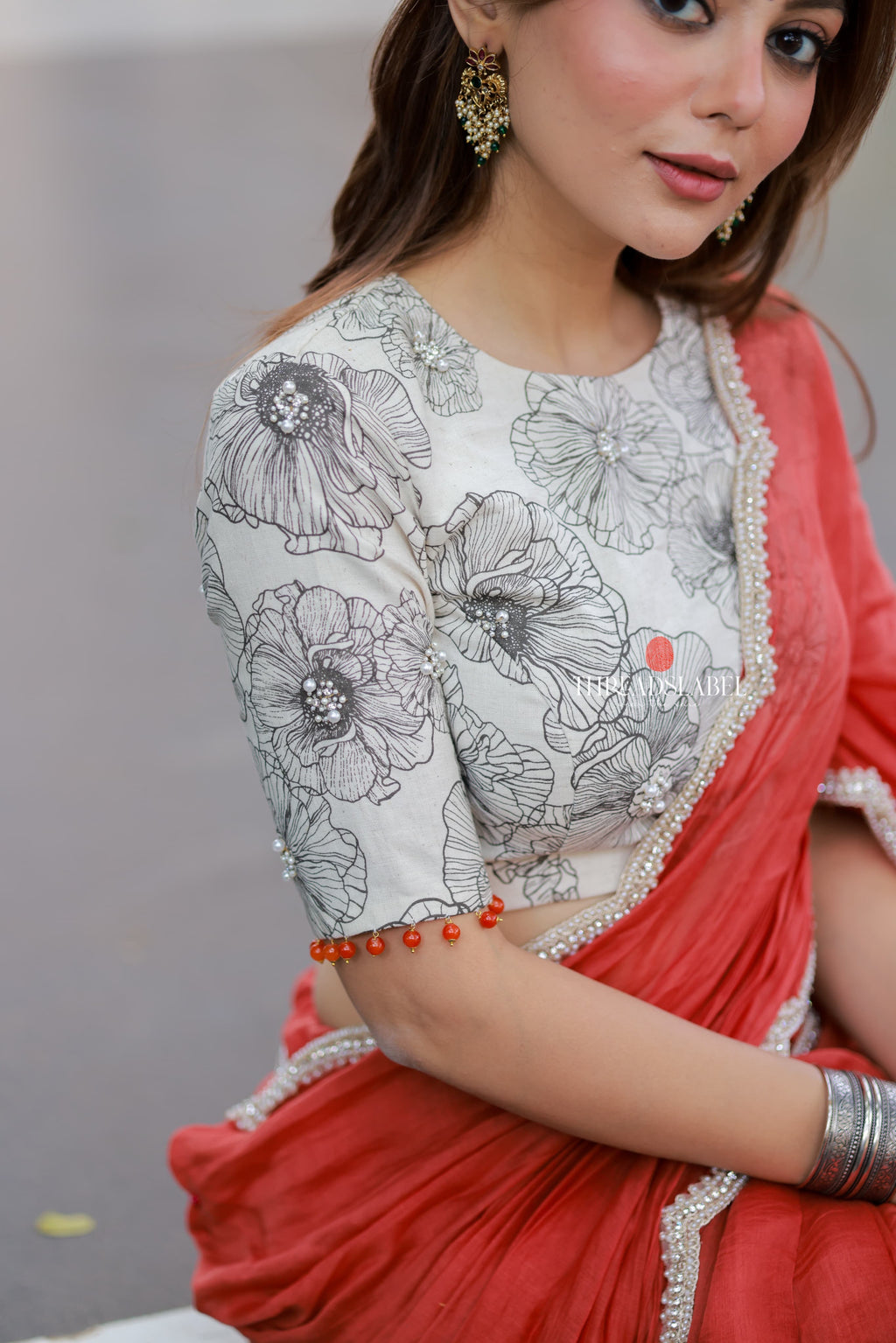 Orange rust saree with pearl work blouse