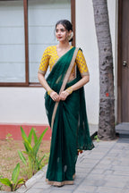 Green organza saree with yellow hand work blouse