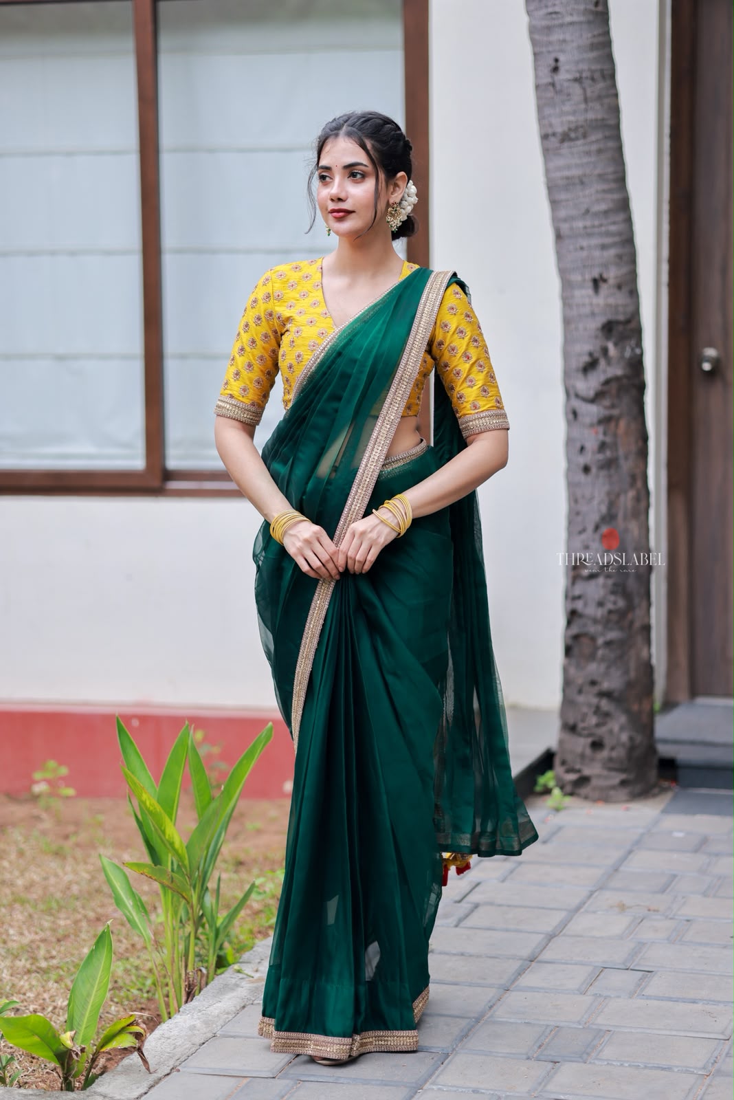 Green organza saree with yellow hand work blouse