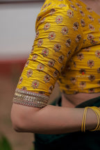 Green organza saree with yellow hand work blouse
