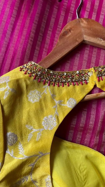 Pink stripped tissue saree with yellow floral hand work blouse