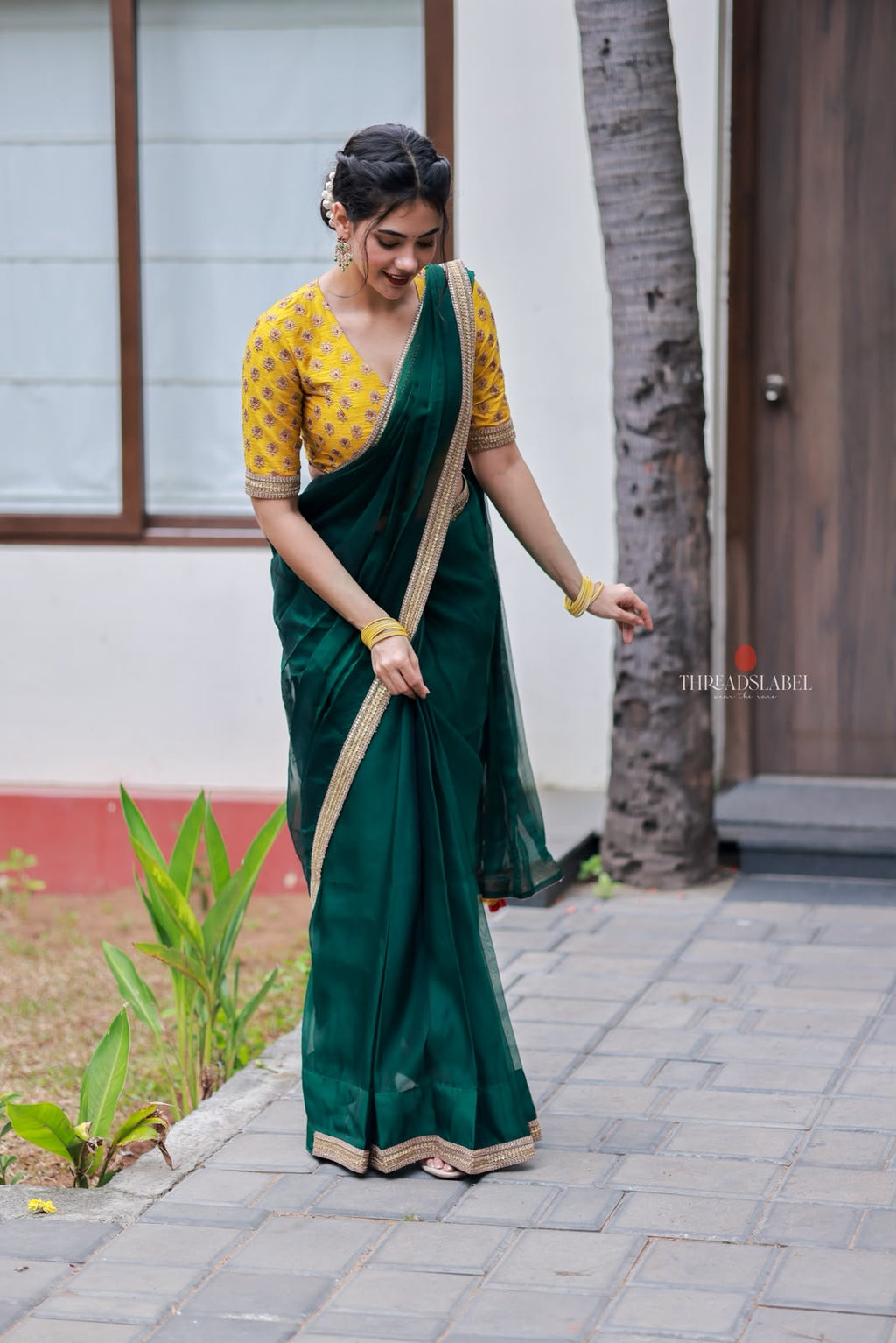 Green organza saree with yellow hand work blouse