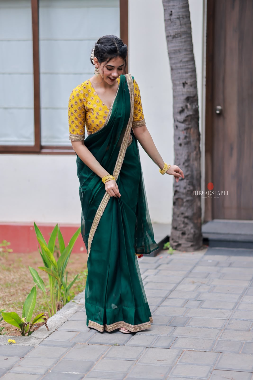 Green organza saree with yellow hand work blouse