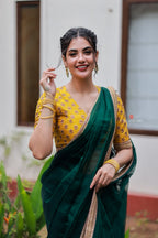 Green organza saree with yellow hand work blouse