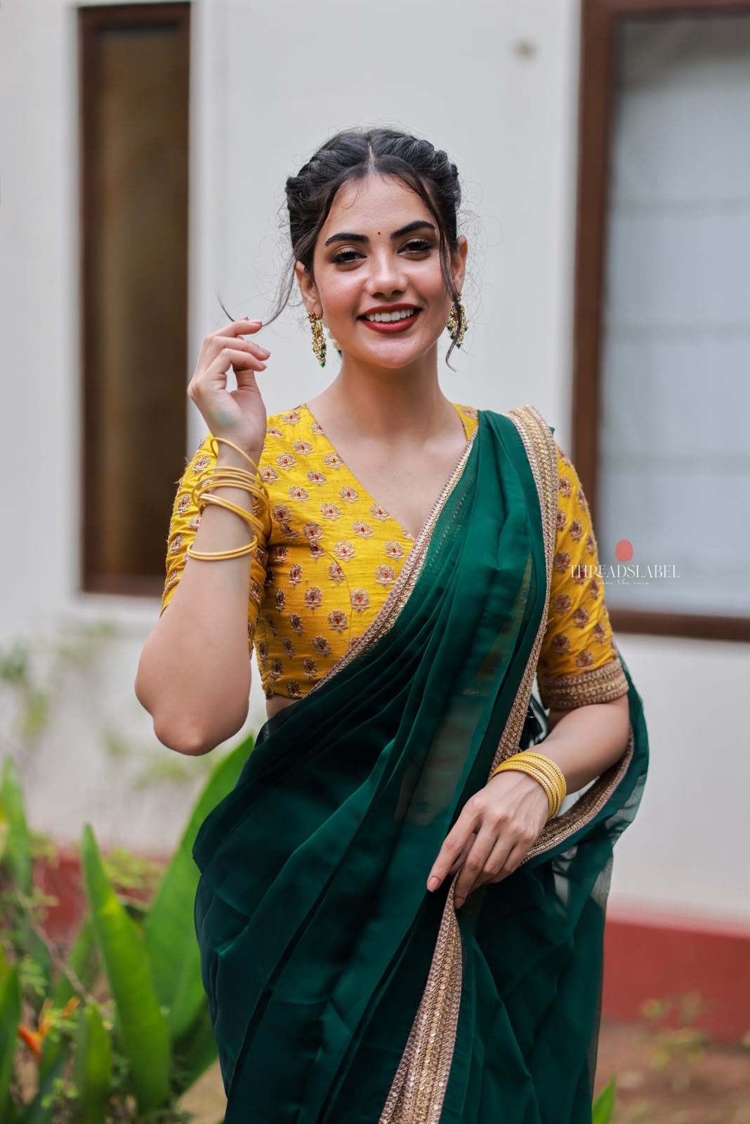 Green organza saree with yellow hand work blouse