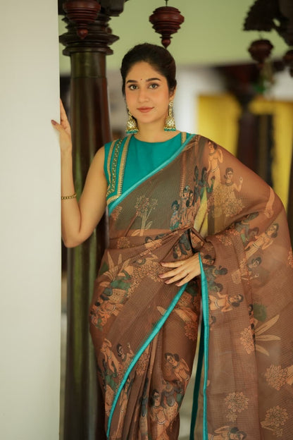 Brown kalamkari kota saree with blue hand work blouse