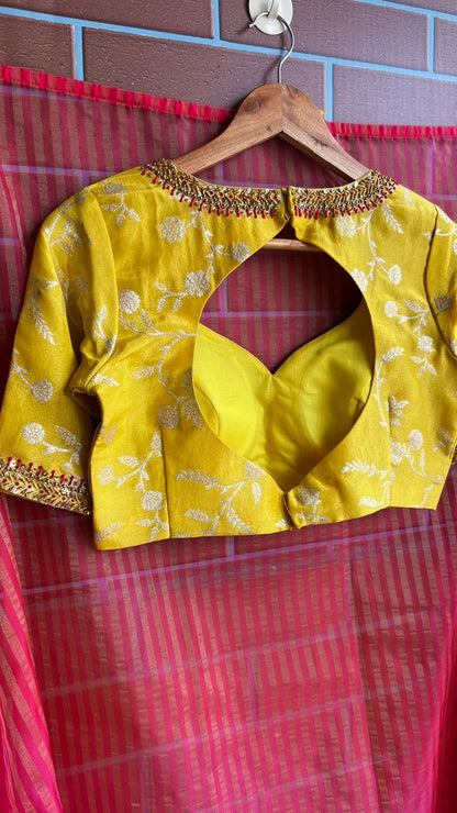 Pink stripped tissue saree with yellow floral hand work blouse