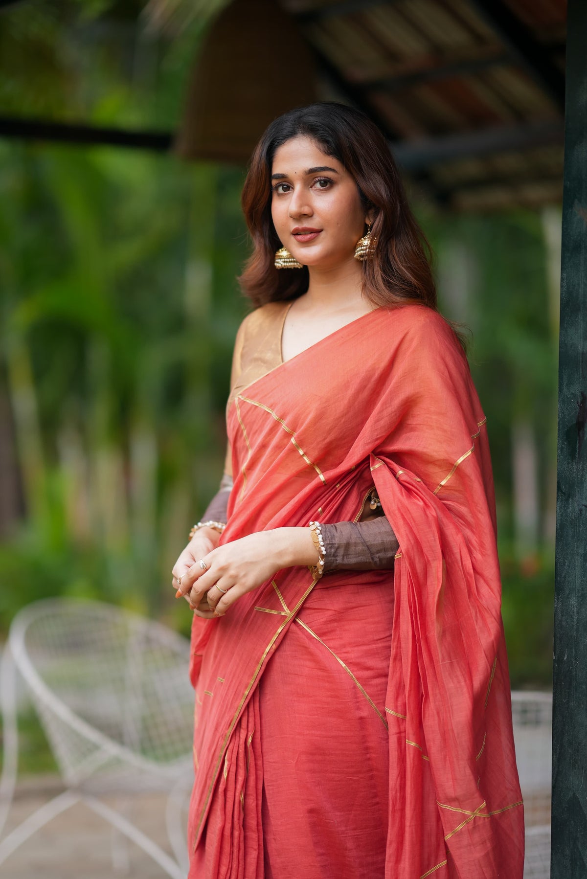 Orange rust saree with tissue handwork blouse