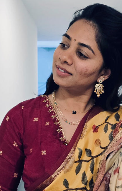 Yellow silk printed saree with hand worked blouse