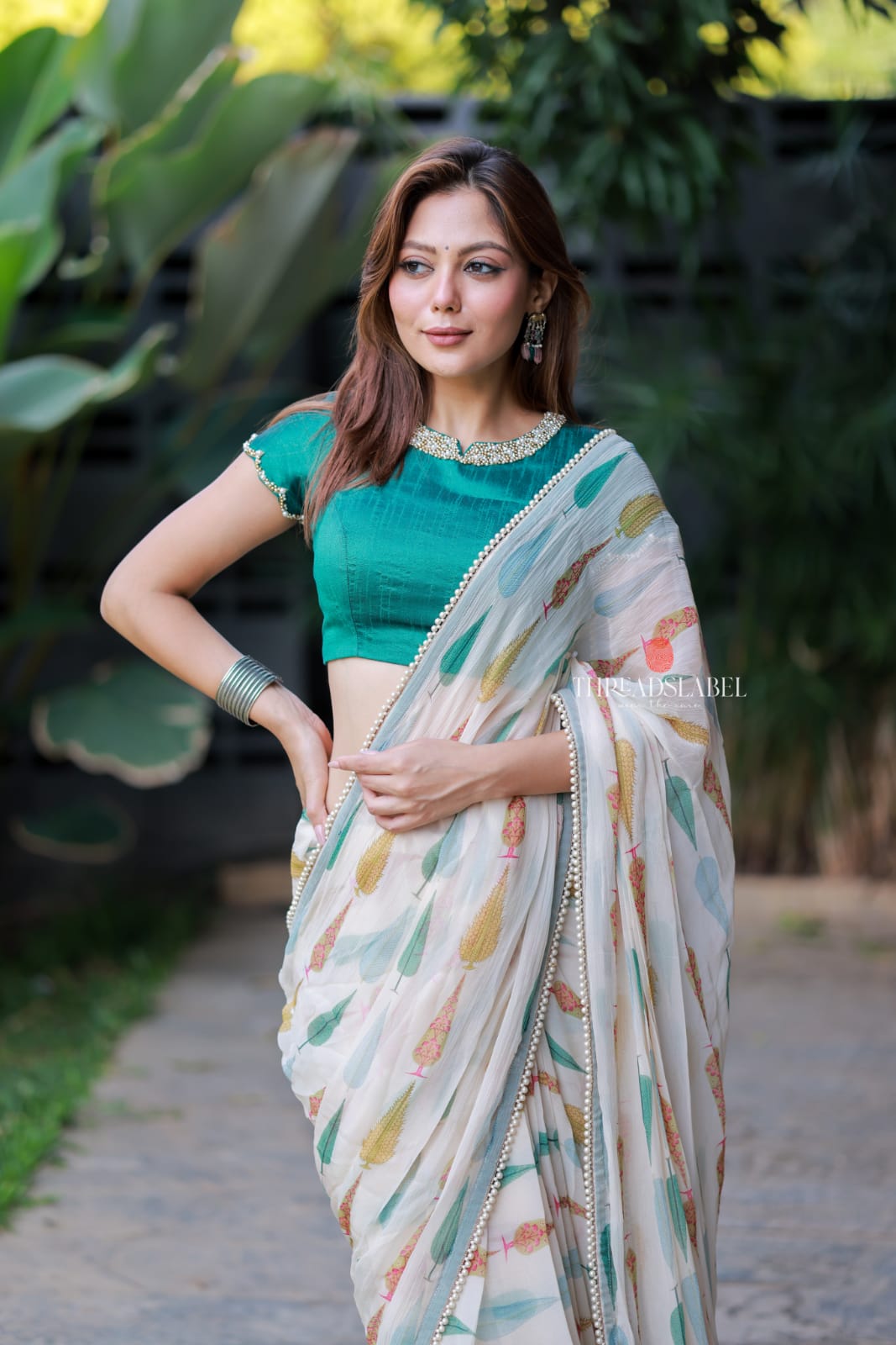 Cream chiffon paisley saree with hand work blouse