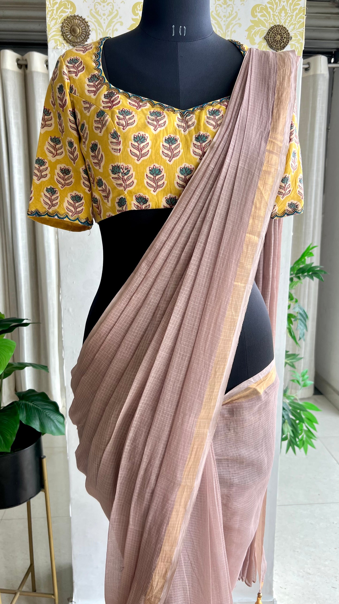 Light peach mul kota saree with yellow hand work blouse