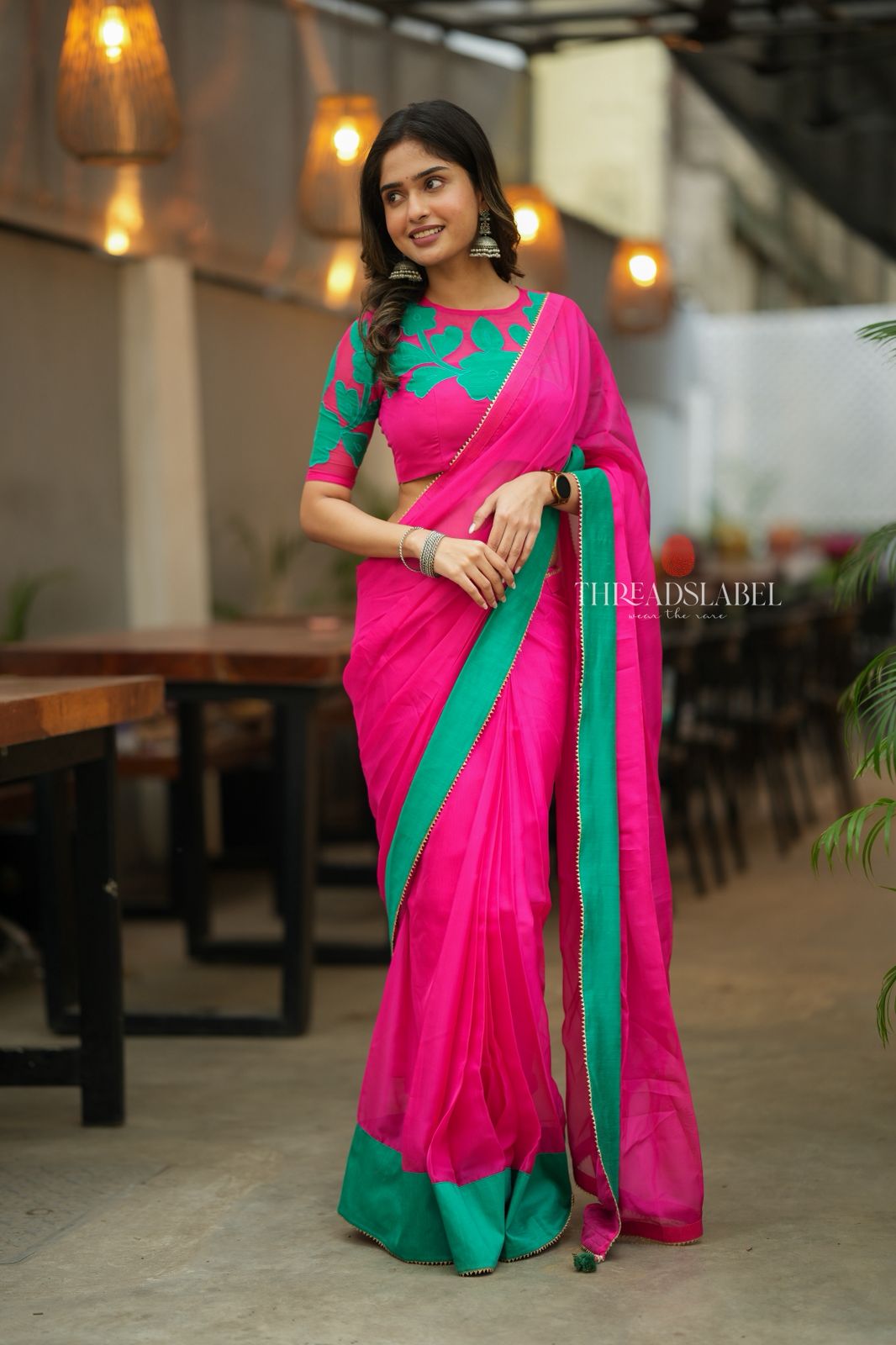 Pink organza saree with floral hand work blouse