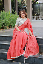 Orange rust saree with pearl work blouse
