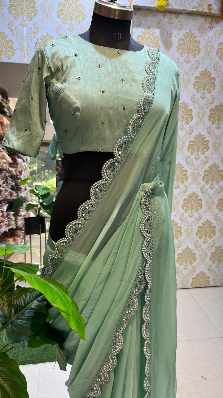 Cyan green saree with hand worked blouse