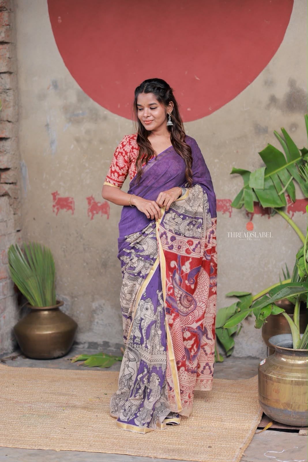 Purple kota saree with kalamkari work blouse