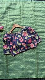 Green stripped tissue saree with purple floral hand work blouse