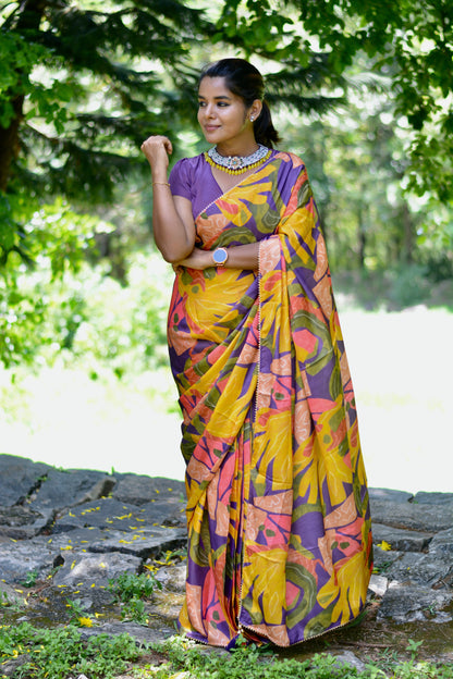 Yellow floral satin saree with purple jewel neck hand work blouse