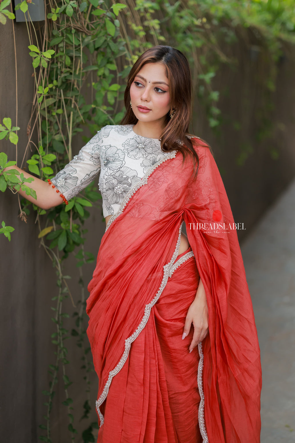 Orange rust saree with pearl work blouse