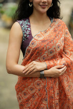 Pastel peach chiffon saree with brown hand work blouse