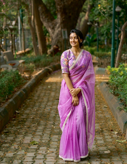 Lavender organza saree with pearl hand work blouse