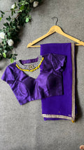 Purple georgette saree with purple jewel neck hand work blouse