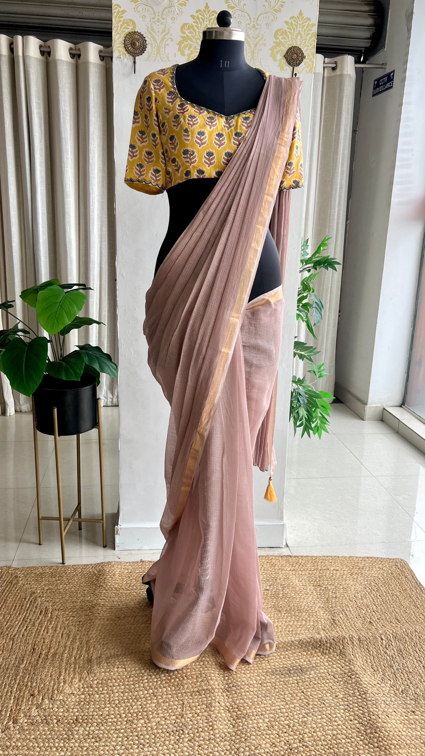 Light peach mul kota saree with yellow hand work blouse
