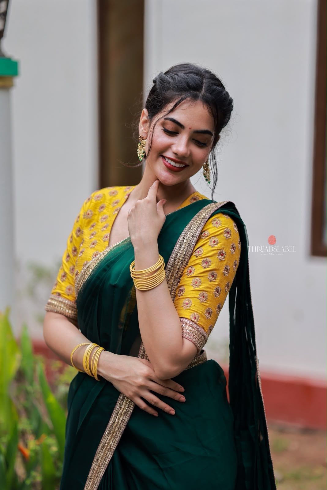 Green organza saree with yellow hand work blouse