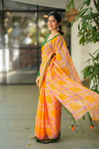 Orange viscose jute saree with green hakoba blouse