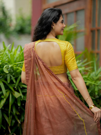 Brown soft organza saree with lime green ikkat blouse