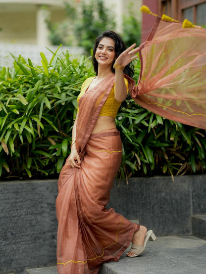 Brown soft organza saree with lime green ikkat blouse