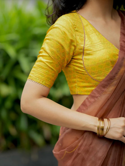 Brown soft organza saree with lime green ikkat blouse