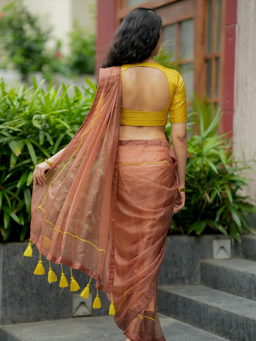 Brown soft organza saree with lime green ikkat blouse