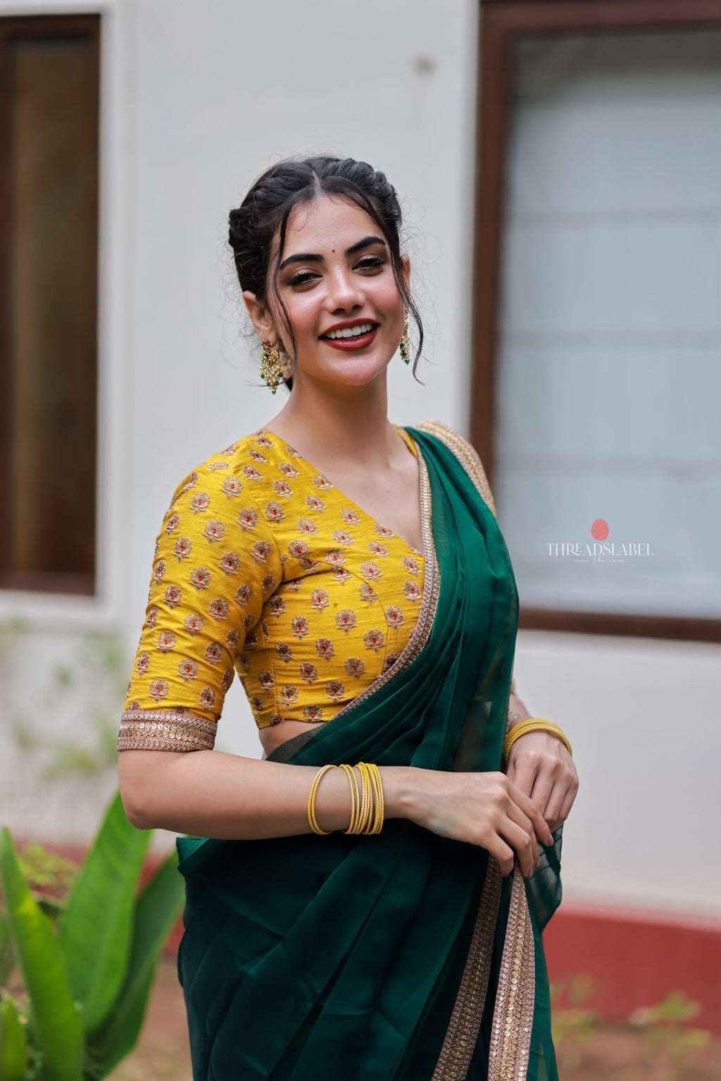 Green organza saree with yellow hand work blouse
