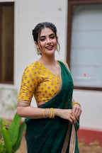 Green organza saree with yellow hand work blouse