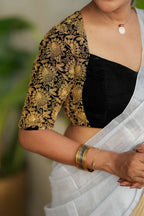 White soft tissue saree with heavy embroidery blouse