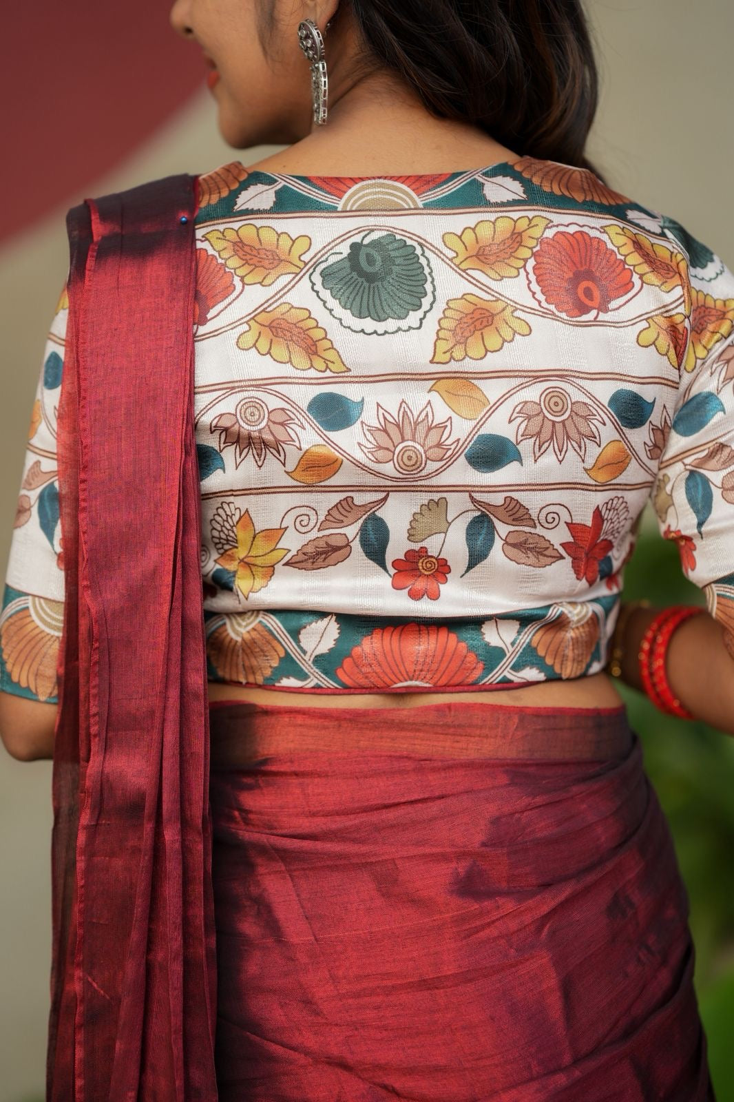 Wine soft tissue saree with floral blouse