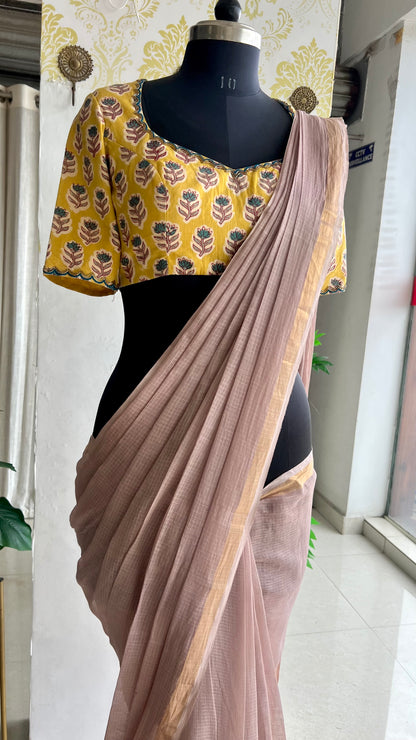Light peach mul kota saree with yellow hand work blouse