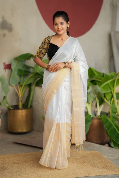 White soft tissue saree with heavy embroidery blouse