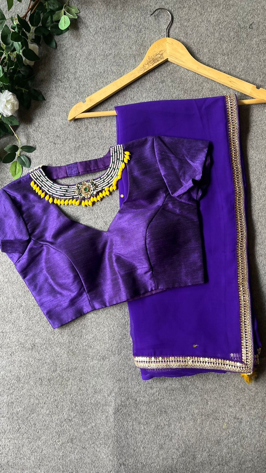 Purple georgette saree with purple jewel neck hand work blouse