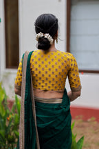Green organza saree with yellow hand work blouse